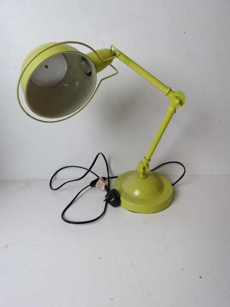 An acid yellow metal angle poise style table lamp.
