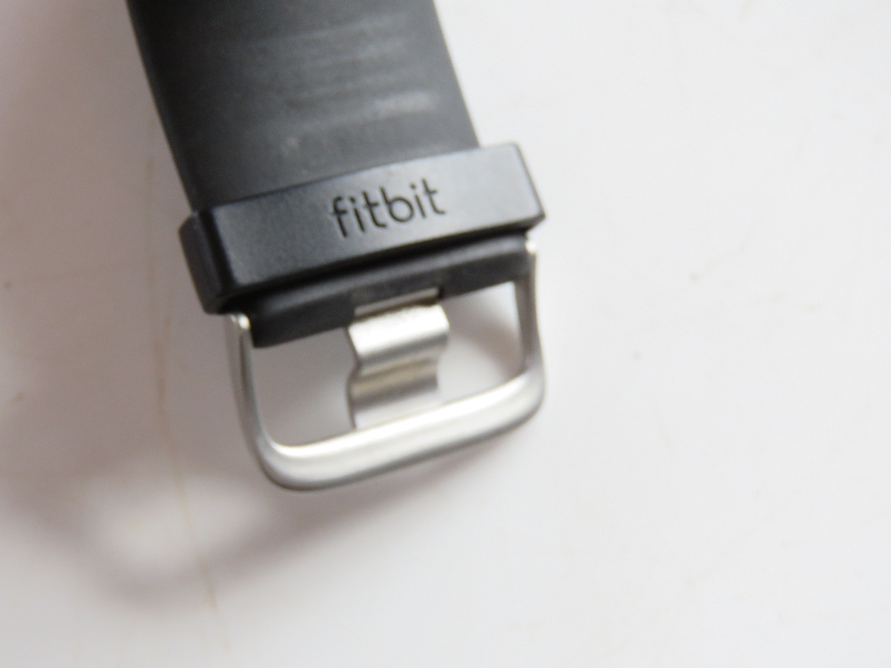 A FitBit on black rubberised strap. - Image 2 of 3