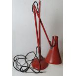 A vintage red metal angle poise lamp, sl