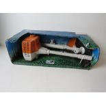 A small Stihl strimmer in box.