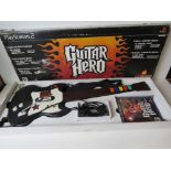 A Playstation 2 Guitar Hero with game in