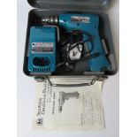 A Makita cordless drill in metal case, w