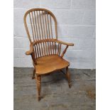 A contemporary pine high backed carver chair measuring approx. 111cm to back.