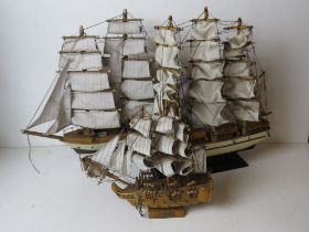 Three model sailing boats being Gorch Fock, Constitution and Victory.