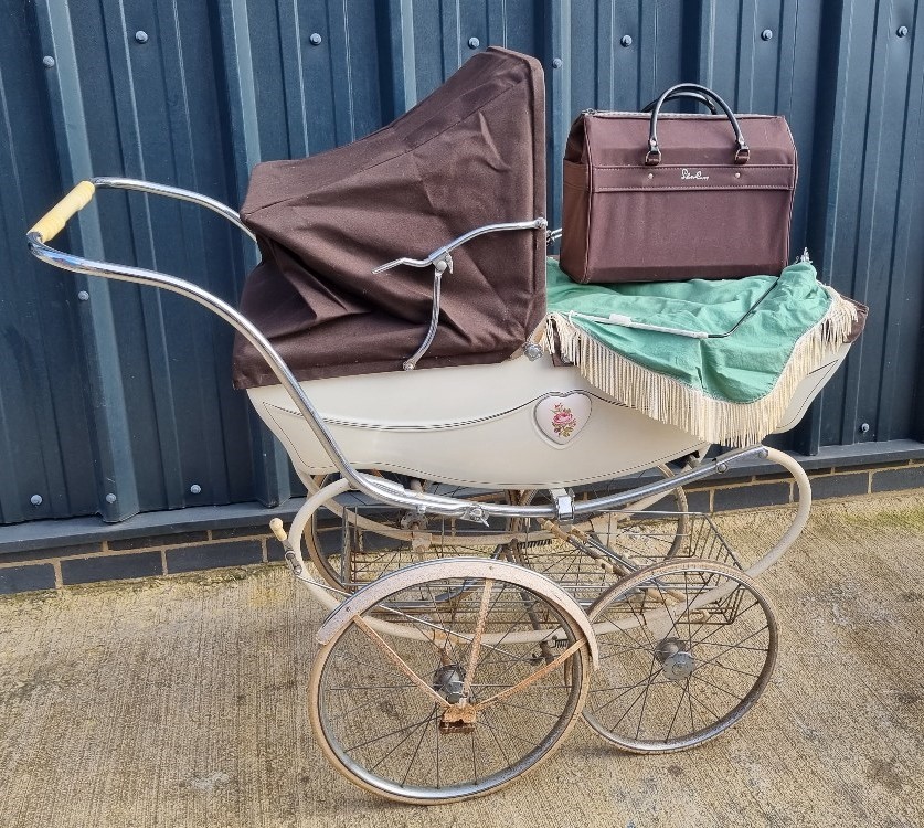 A Silver Cross pram having hood, sunshade, handbag, etc.