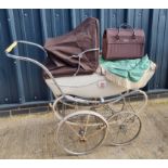 A Silver Cross pram having hood, sunshade, handbag, etc.