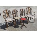 A set of four (2+2) wheel back dining chairs c1950s, raised over spindle turned legs.