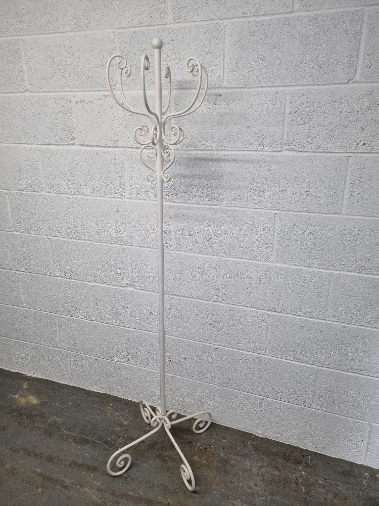 A contemporary white painted free standing hat stand.