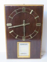 A mid century day date wall clock marked Puja to the movement.