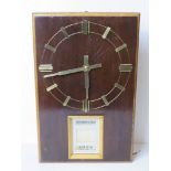 A mid century day date wall clock marked Puja to the movement.