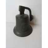 A wall bell numbered 1841, with clanger.