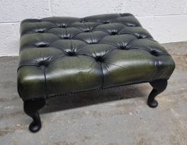 A green leatherette Chesterfield type footstool. Footstool approx. 62 x 48cm.