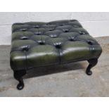 A green leatherette Chesterfield type footstool. Footstool approx. 62 x 48cm.