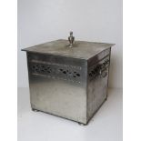 A chromed square shaped log or coal bin.