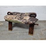 A camel stool in need of re-upholstering having brass inlay throughout.