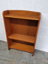 A late 20thC bookcase approx 62cm wide.