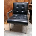 A contemporary 1950s style black leatherette office chair.