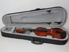 A violin with bow in case.