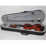 A violin with bow in case.