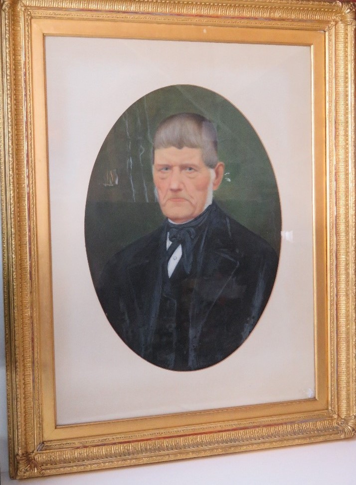 A fine portrait of a Victorian gentleman in black suit, unsigned, mounted in oval slip,