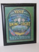 A naively painted Visit Brooklands Racing Circuit sign, in frame, for restoration,