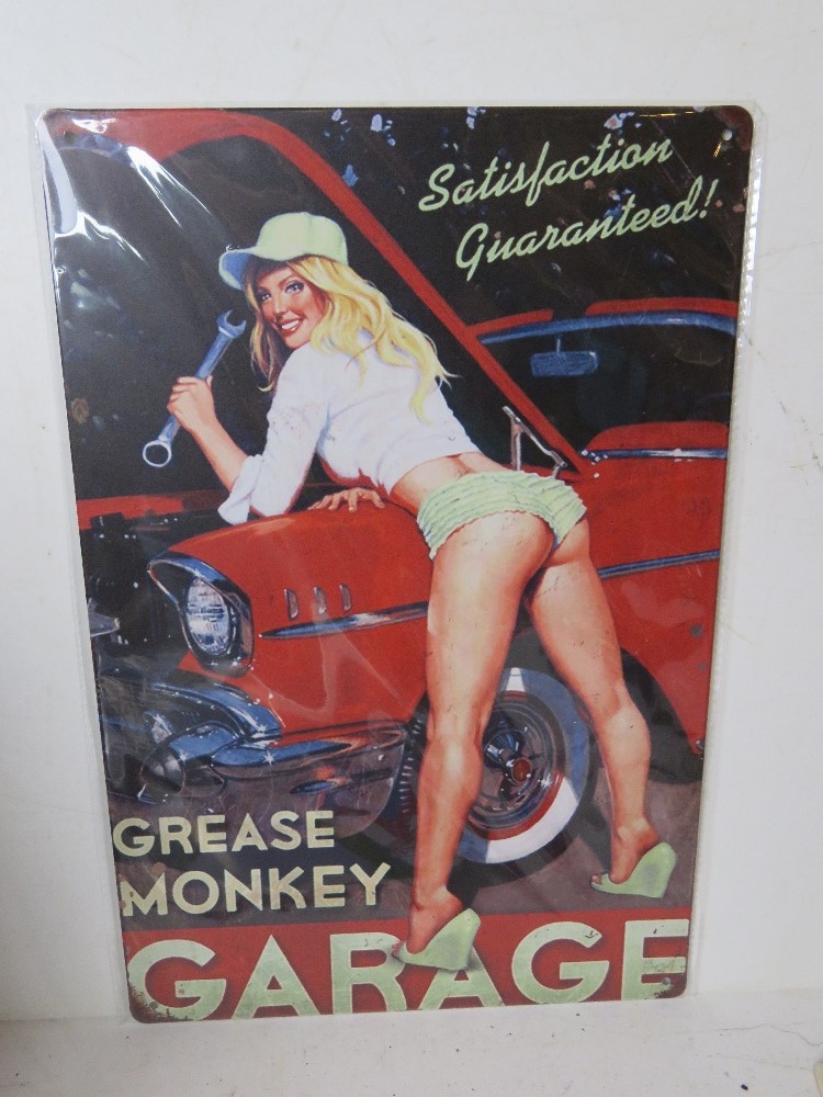 A contemporary metal garage Grease Monkey advertising sign, 30 x 20cm.