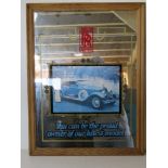 A Rolls Royce advertising mirror in pine frame measuring 50 x 66cm overall.