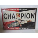 A contemporary metal garage Champion spark plugs advertising sign, 30 x 20cm.