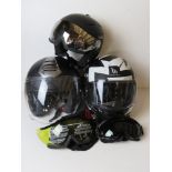 Three motorbike helmets for decorative display purposes only.