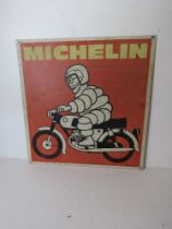 A printed aluminium Michelin Mr Bibendum on motorbike sign measuring approx 43 x 44.5cm.