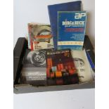 A quantity of assorted vehicle parts catalogues and automotive magazines.