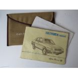 An Alfa Romeo 90 2.5 handbook in original cloth pouch.