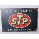 A contemporary metal garage STP oil treatment advertising sign 'The Racers Edge', 30 x 20cm.