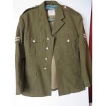 A British Army No 2 dress tunic, size 23, having patches upon.