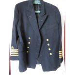 A British Naval jacket having brass buttons and four gilt stripes to cuff.