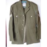 A British Army No 2 dress tunic, size 32, having patches and buttons upon.