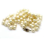 A set of faux pearls having 9ct gold clasp.