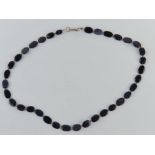 A blue goldstone beaded necklace with silver clasp stamped 925 approx 42cm in length.