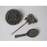 A cut steel brooch of floral design together with a cut steel butterfly hat pin and a white metal