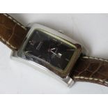 A men's Fossil Aut-O-Matic Signature wrist watch having skeleton back,