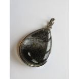 A large hardstone pendant of teardrop form set in white metal stamped 925, approx 5.6cm in length.