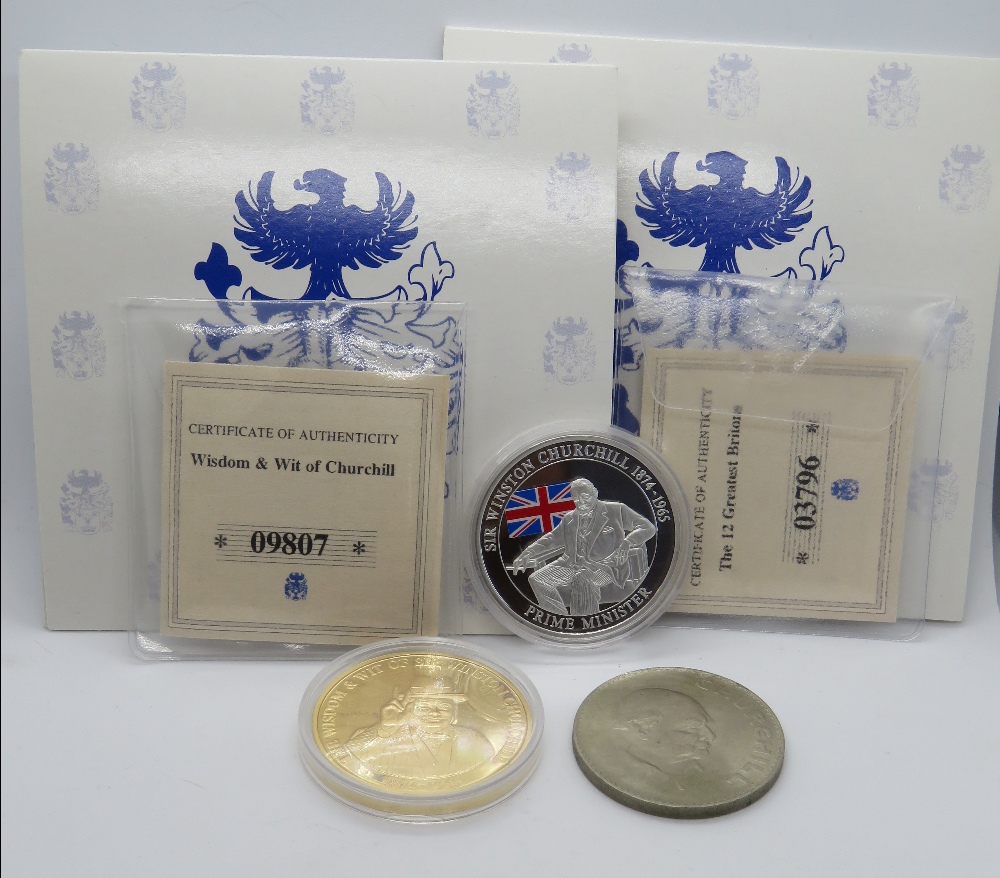 Three Churchill commemorative coins including two proof coins in packaging.