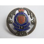 A sterling silver enamel and marcasite Royal Army Ordnance Corps sweetheart brooch.