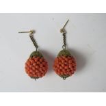 A pair of Czechoslovakian style mid century gilt metal and faux coral bead earrings.