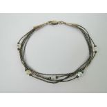 A Native American Navajo style silver bead and crystal bracelet,