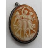 A carved shell cameo brooch/pendant featuring three muses dancing, 38mm in length.