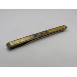 A 9ct gold on silver tie clip, engraved RW.
