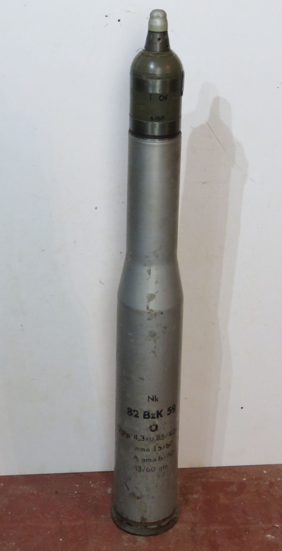 An inert 82mm NK 82 Bzk 59 shell with stencilling upon, approx. 95cm in length.