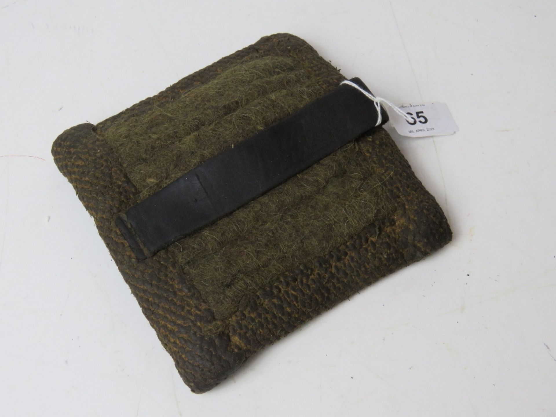 A WWII German MG34/ MG42 hot barrel mitt with leather strap.