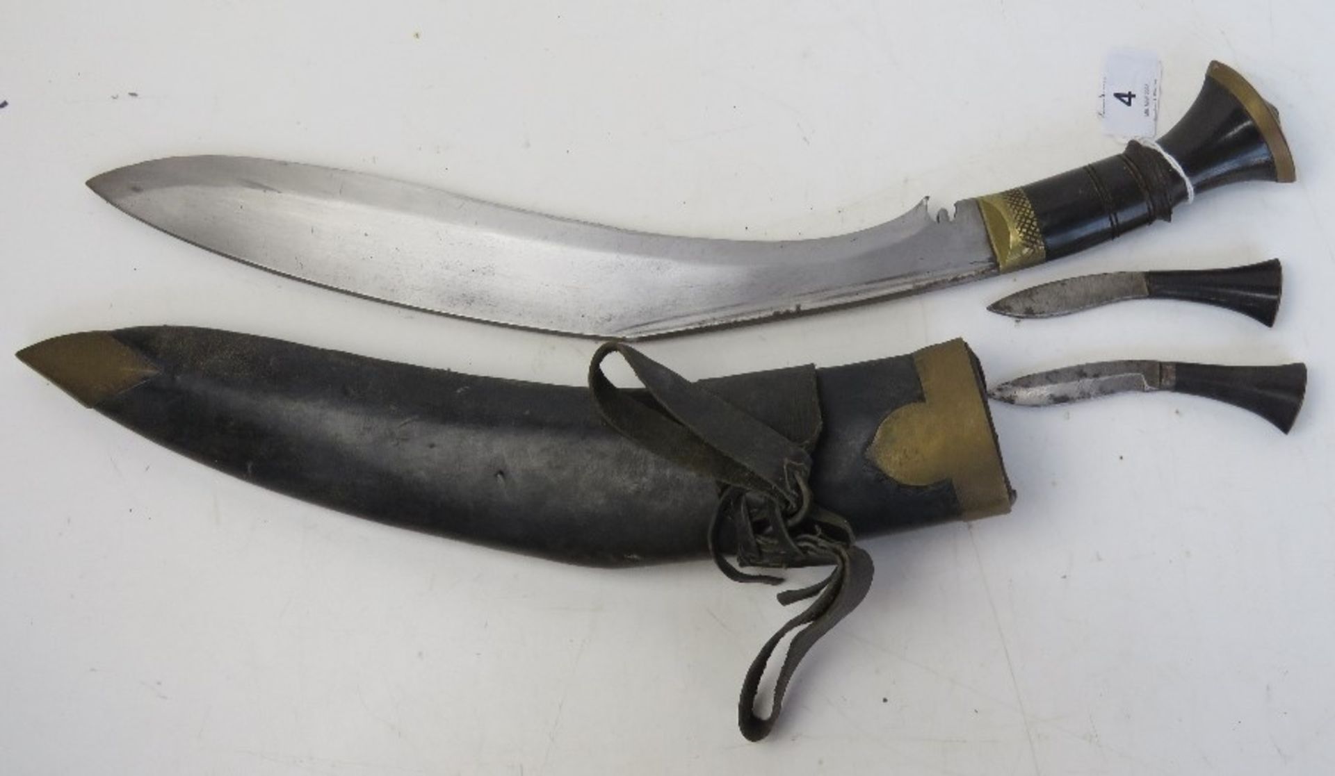 A Gurkha Kukri knife with scabbard, with the Karda and Chakmak blades, with belt loops.